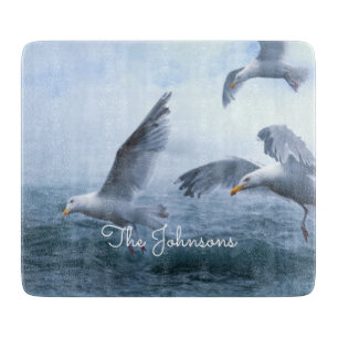 Seagulls Flight over the Sea Cutting Board