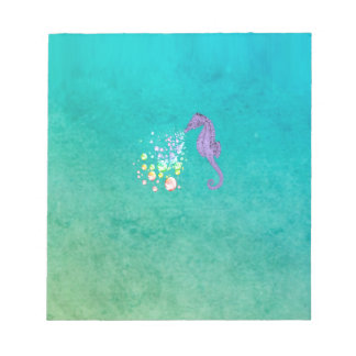 Seahorse blowing rainbow bubbles in the water notepad