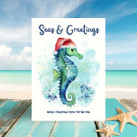 Seahorse Santa Seas & Greetings Nautical Christmas Holiday Card<br><div class="desc">Celebrate the season with a splash! This nautical Christmas card features a charming seahorse sporting a Santa hat and an abstract ocean background in tropical turquoise,  navy blue,  gold and green—perfect for adding a beach-y vibe to your holiday “Seas & Greetings”. Art by KL Stock</div>