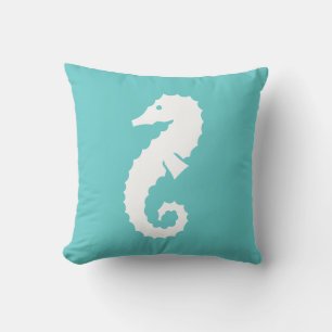 SEAHORSE WHITE on teal blue pillow