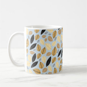 Seamless pattern of autumn leaves on a blue backgr coffee mug