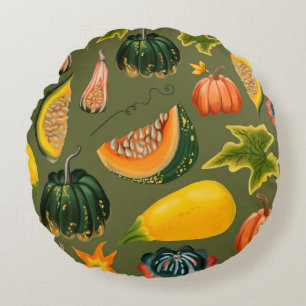 Seamless pattern of pumpkins and leaves on a green round cushion