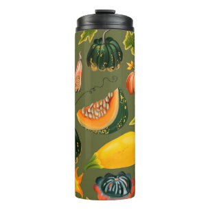 Seamless pattern of pumpkins and leaves on a green thermal tumbler