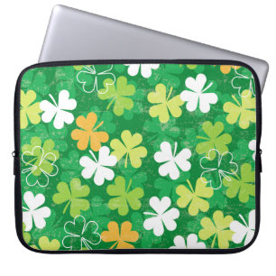 Seamless pattern of scattered clovers and shamrock laptop sleeve
