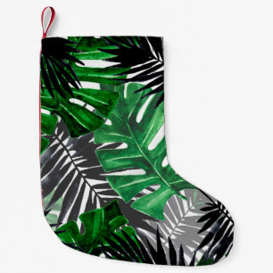 seamless pattern of tropical leaves and elements o small christmas stocking
