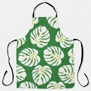Seamless pattern of white monstera leaves on a dar apron