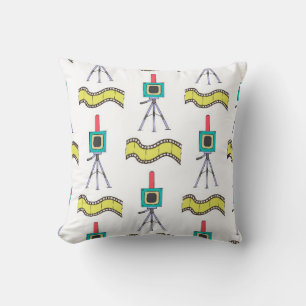 Seamless pattern with cameras and film strips on a cushion