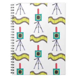 Seamless pattern with cameras and film strips on a notebook