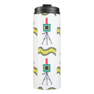 Seamless pattern with cameras and film strips on a thermal tumbler
