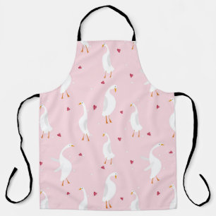Seamless pattern with cute duck with heart on pink apron