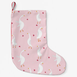 Seamless pattern with cute duck with heart on pink small christmas stocking