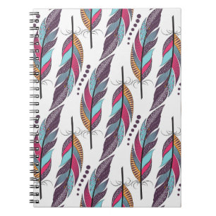 Seamless pattern with large colored feathers and d notebook
