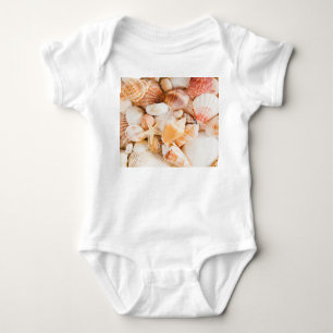 Seashells background: marine theme. baby bodysuit
