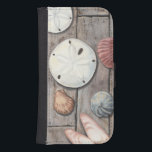 Seashore Treasures Samsung S4 Wallet Case<br><div class="desc">Megan Meagher is known for her simple art pieces. This image captures the simplicity of the seashore's treasures, including sand dollars and seashells in a pastel coloured tone. Meagher encompasses a wooden background in her image to contrast these treasures. Get this fine art print today on wood colour on your...</div>