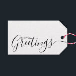 Season's Greetings Black White Minimalist Gift Tag<br><div class="desc">This minimalist and elegant gift tag features black Season's Greetings text on the front side and on the back side personalise it with your name or family name. The background is in white colour.</div>