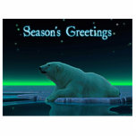 Season's Greetings - Ice Edge Polar Bear Photo Sculpture Magnet<br><div class="desc">A peaceful moment in the long Arctic night. A Polar Bear rests at the edge of an open area in the pack ice. The Northern Lights glow in the distance; bright stars twinkle overhead. "Season's Greetings" appears in glowing blue and white. Add your own text. Polar bears are endangered. How...</div>