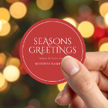Seasons Greetings Red Modern Elegant Business Classic Round Sticker<br><div class="desc">Custom business Christmas stickers featuring Seasons Greetings in elegant modern typography. Add your own personalised Christmas greeting or short thank you message to corporate clients and customers.</div>