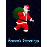 Season's Greetings - Santa Claus Photo Sculpture Magnet<br><div class="desc">Do you believe in Santa? An image of a striding Santa Claus,  carrying a green bag of presents; superimposed on a starry background. Text reading "Season's Greetings" appears in glowing blue and white.</div>