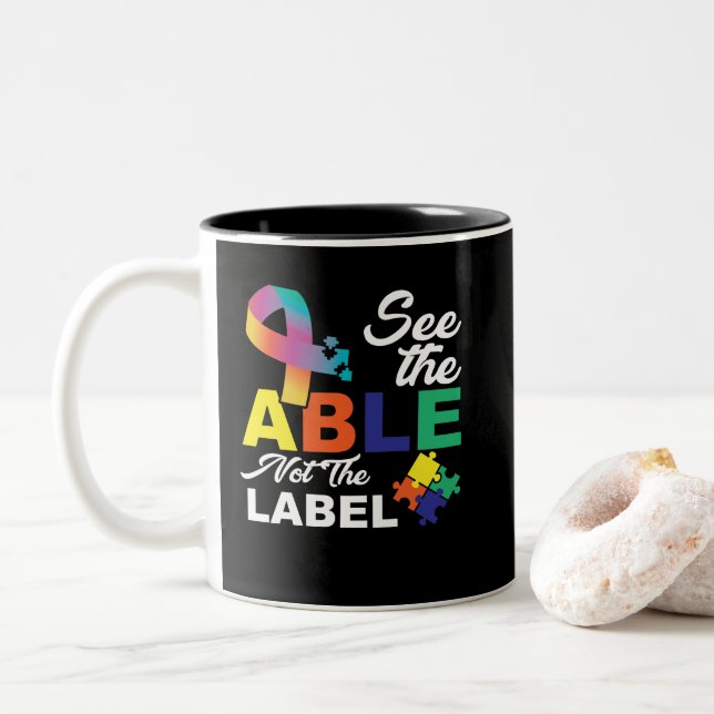 See the Able Not The Label Cute Autism Awareness Two-Tone Coffee Mug (With Donut)