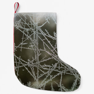 Selective focus of snowflakes small christmas stocking