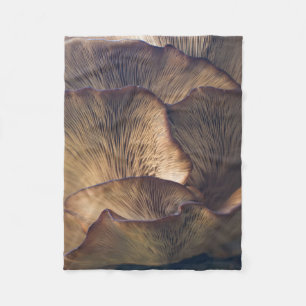 Selective focus photo of mushroom fleece blanket