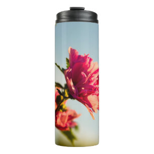 Selective focus photo of pink hibiscus flower thermal tumbler