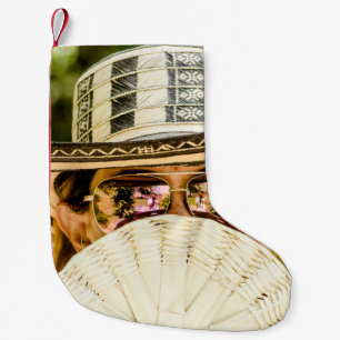 Selective focus photo of woman wearing aviator sun small christmas stocking