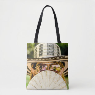 Selective focus photo of woman wearing aviator sun tote bag