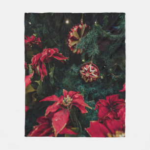 SELECTIVE FOCUS PHOTOGRAPHY OF RED POINSETTIA PLAN FLEECE BLANKET