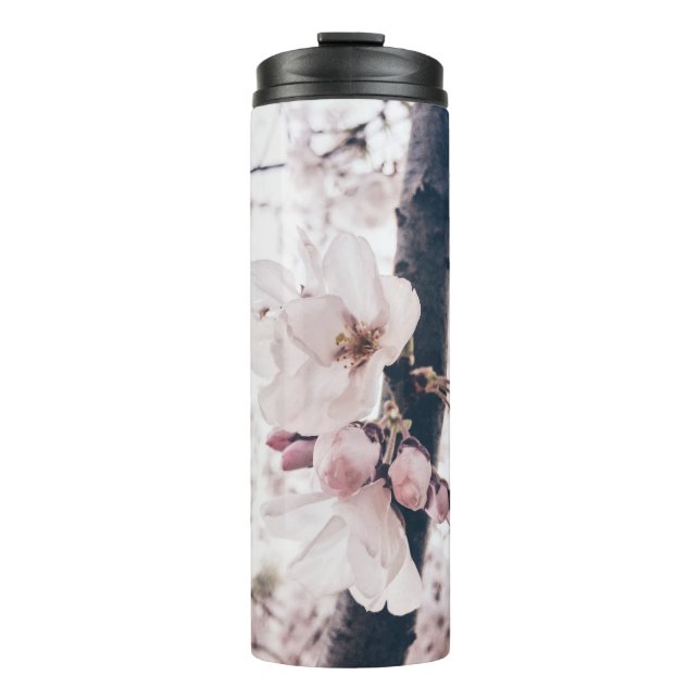 SELECTIVE FOCUS PHOTOGRAPHY OF WHITE AND PINK PETA THERMAL TUMBLER (Front)