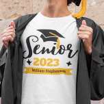 Senior class graduation year name T-Shirt<br><div class="desc">Celebrate your senior and graduation year with this modern t-shirt featuring a contemporary "Senior 20xx" typography in black and gold decorated with a black graduate cap with a golden tassel; easily customise this t-shirt with your graduation year and name by editing the template fields. This t-shirt is part of our...</div>