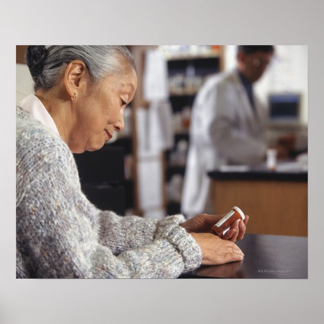 Senior woman in pharmacy reading medicine bottle poster (Front)