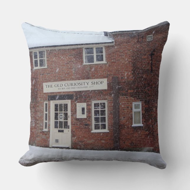 sepia photo of the old curiosity shop in snow cushion (Front)