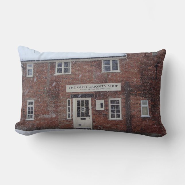 sepia photo of the old curiosity shop in snowscene lumbar cushion (Front)