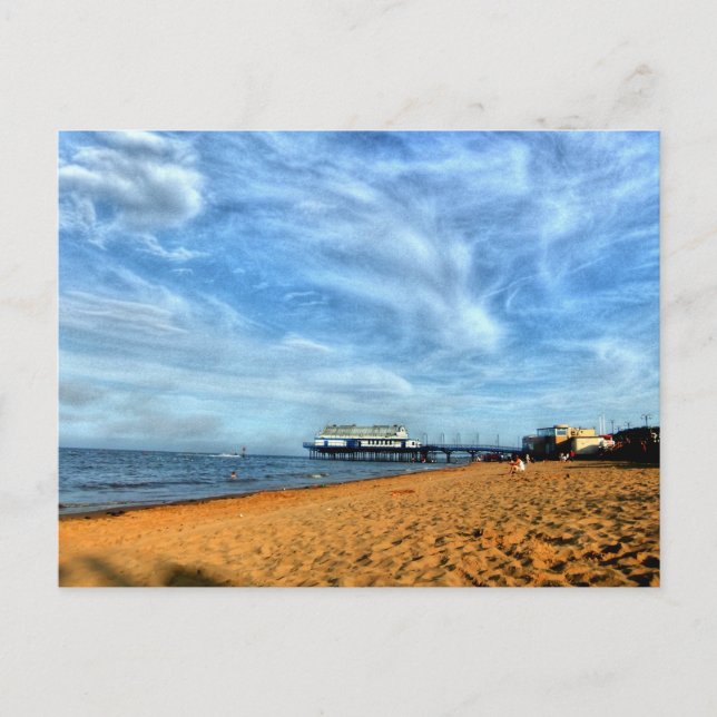 Serene Bright Beach With Pier & Marbled Clouds Postcard (Front)