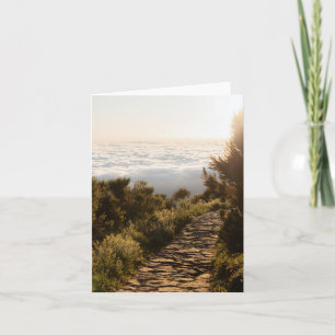 Serene path above the clouds with golden sunrise card
