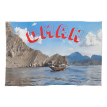 Serene waters and majestic Omani mountains