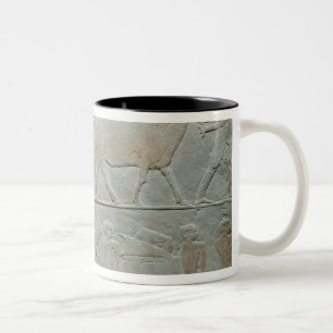 Servants driving an oryx and an antelope Two-Tone coffee mug