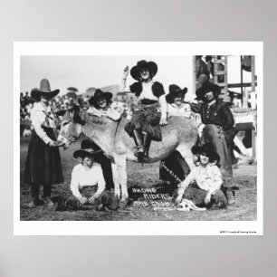Seven rodeo cowgirls jokingly posing with a donkey poster