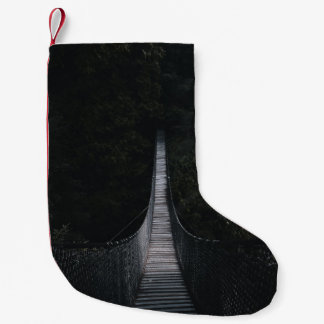 SHALLOW FOCUS PHOTO OF BROWN WOODEN BRIDGE SMALL CHRISTMAS STOCKING