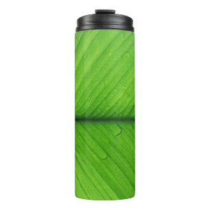 Shallow focus photo of green leaf thermal tumbler