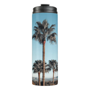 Shallow focus photo of palm trees in the morning thermal tumbler