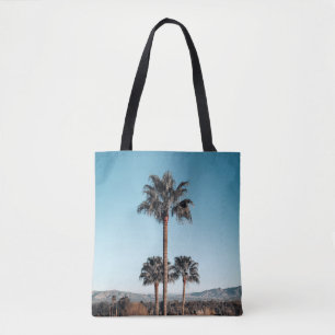 Shallow focus photo of palm trees in the morning tote bag