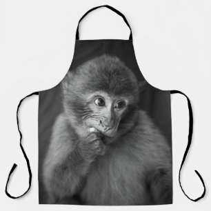SHALLOW FOCUS PHOTOGRAPHY OF BLACK MONKEY APRON
