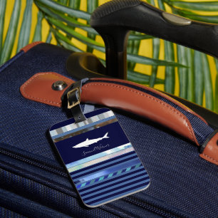 shark with name on striped blue luggage tag