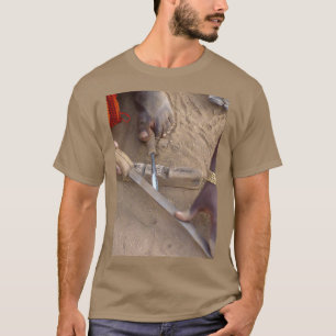 Sharpening an iron spear head made by the Gidonwod T-Shirt