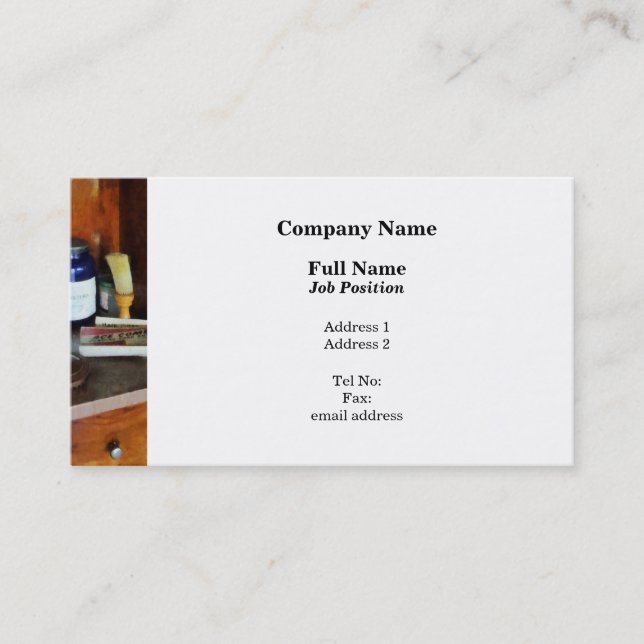 Shaving Brush and Box of Combs Business Card (Front)