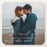 She Said Yes Calligraphy Engagement Party Photo Square Paper Coaster<br><div class="desc">It's time to celebrate! Our She Said Yes Calligraphy Engagement Party Coaster features your full bleed engagement photo with a white hand lettered overlay saying 'she said yes' personalised with your names in a combination of white sans serif and hand written calligraphy script fonts - a beautiful design for a...</div>