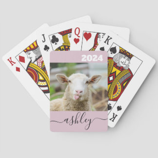 Sheep show tongue playing cards