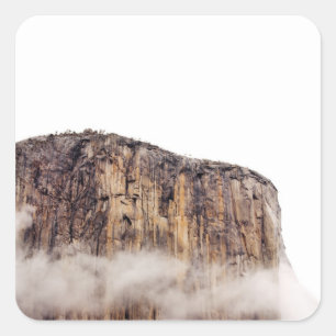 Sheer cliff rising above clouds square sticker